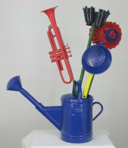 Watering can with black iris, carnation, tulip and blue chrysantemum